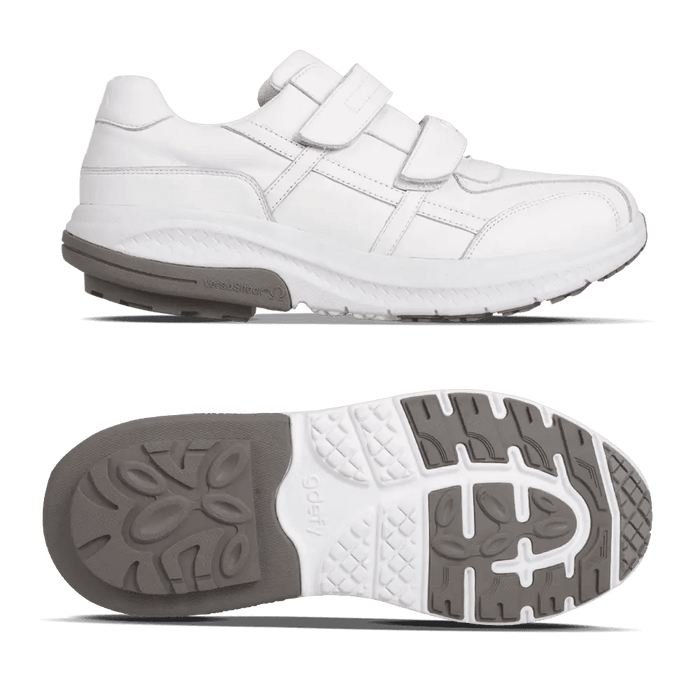 White athletic shoe with two hook-and-loop straps and a thick sole, shown with its gray and white patterned outsole.