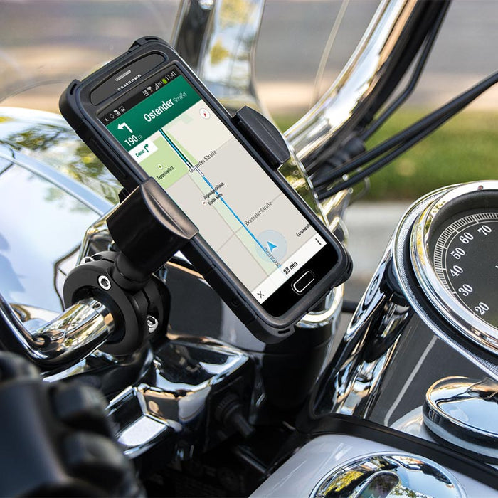 A smartphone with a navigation map is mounted on motorcycle handlebars using the RoadVise® XL Motorcycle Phone Mount - Black Aluminum, surrounded by chrome parts and a speedometer. The phone stays secure in the mount, ready for route guidance.