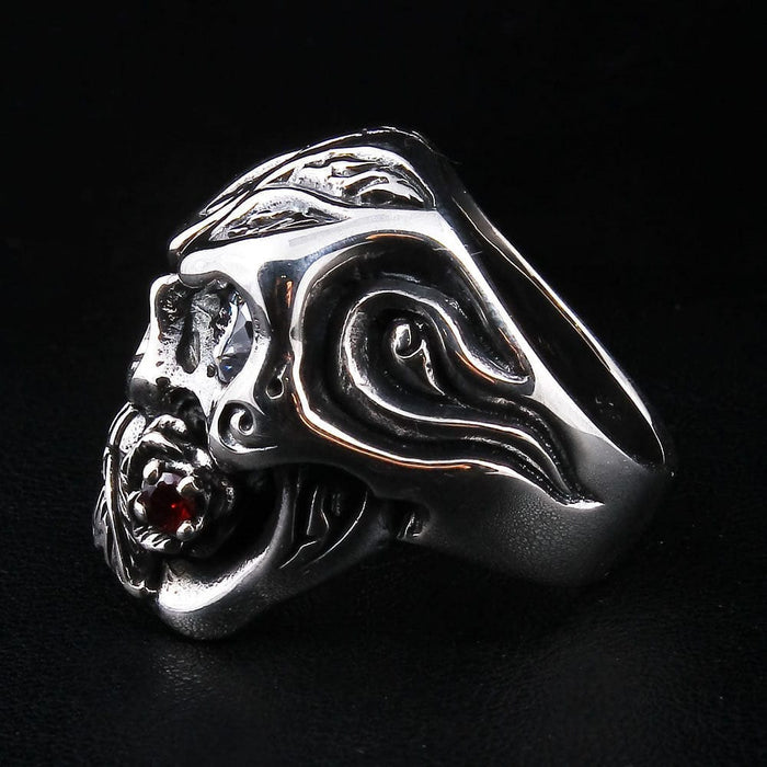 The handcrafted rose skull ring presented on a dark background to emphasize its polished sterling silver finish.