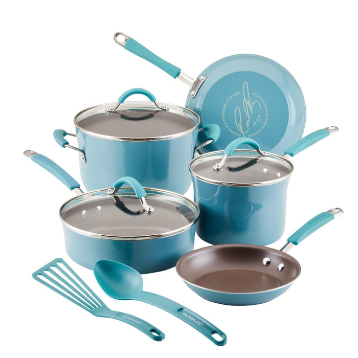 The 10-Piece Cucina Nonstick Cookware Set by Rachael Ray includes teal pots and pans with shatter-resistant glass lids, and comes with both a spatula and a spoon.