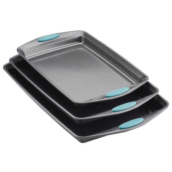 The 3-Piece Nonstick Sheet Pan Set includes three stacked rectangular baking pans with teal handles, crafted from durable steel and oven safe.