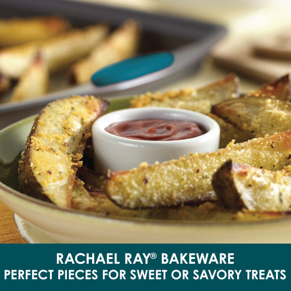 On a plate, potato wedges accompanied by dipping sauce are displayed enticingly, having been cooked to perfection on the 3-Piece Nonstick Sheet Pan Set.