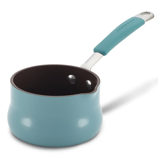 The .75-Quart Cucina Nonstick Butter Warmer is a blue saucepan made from durable aluminum, featuring a spout, non-stick interior, and a long handle.