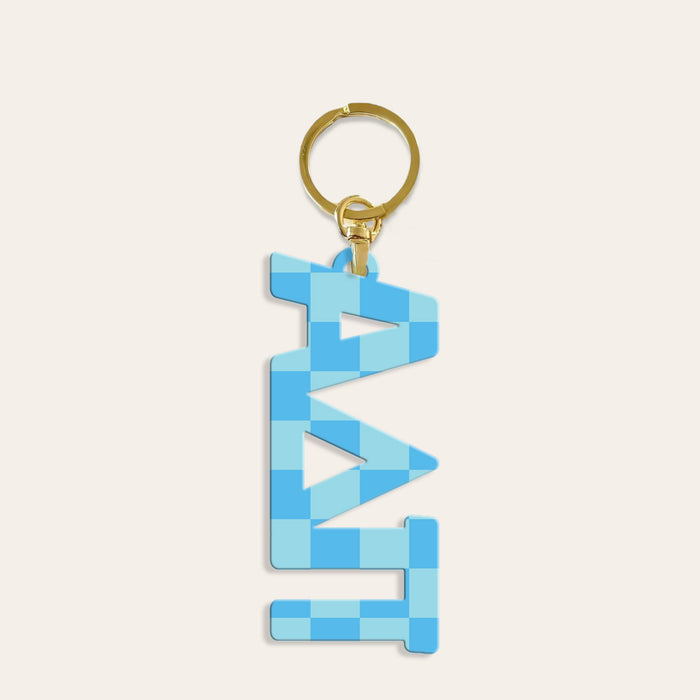 The Darling Effect’s Alpha Delta Pi Acrylic Keychain features a gold keychain with a blue checkered “DAD” pendant—a unique sorority accessory and thoughtful bid day gift.