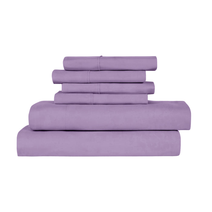 Set of purple bed sheets and pillowcases on a white background