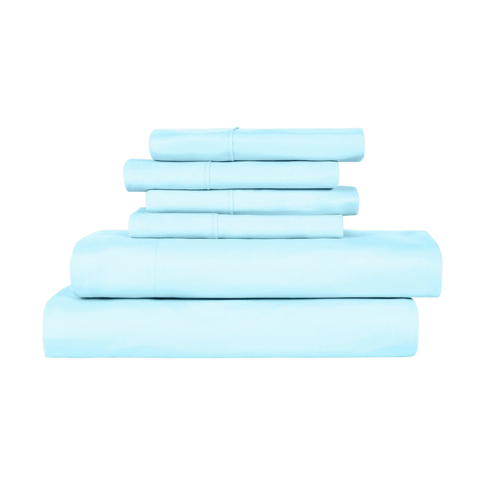 Set of light blue bed sheets stacked on a white background