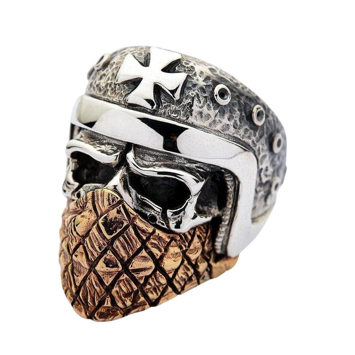 A premium two-tone motorcycle skull ring in sterling silver and copper, with a Maltese cross on the helmet.