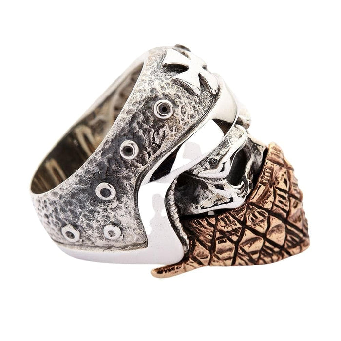 A side view of the handmade biker skull ring, showing the intricate detail of the helmet and the band.