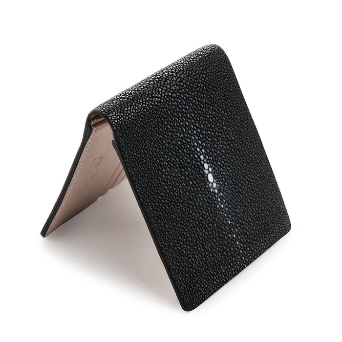 The soft, beige cowhide interior of the men's stingray wallet, displaying the multiple card slots and clear ID windows.