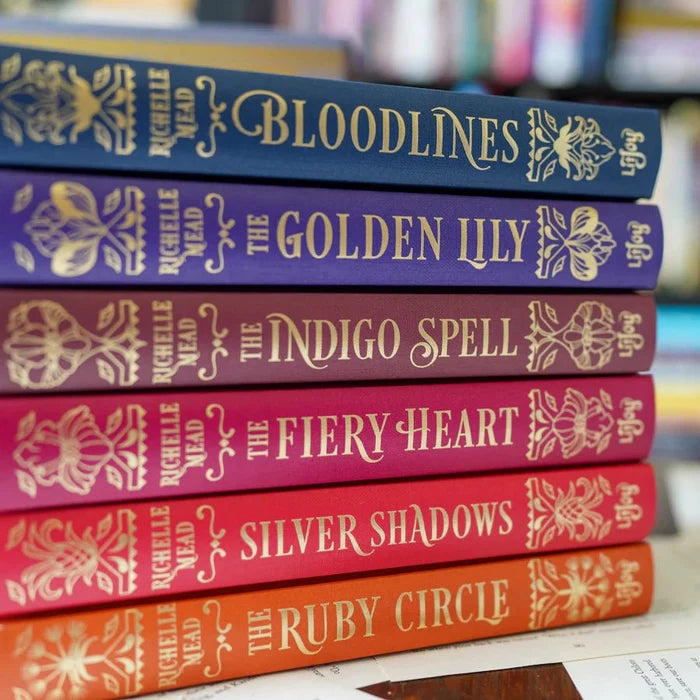 Bloodlines Special Edition Box Set by Richelle Mead – stacked hardcover spines showing Bloodlines, The Golden Lily, The Indigo Spell, The Fiery Heart, Silver Shadows, and The Ruby Circle in gold foil lettering