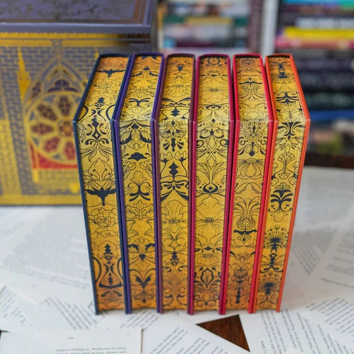 Bloodlines Special Edition Box Set by Richelle Mead – six hardcover books standing upright showing ornate gold-embossed cover patterns with purple, red, and orange edges