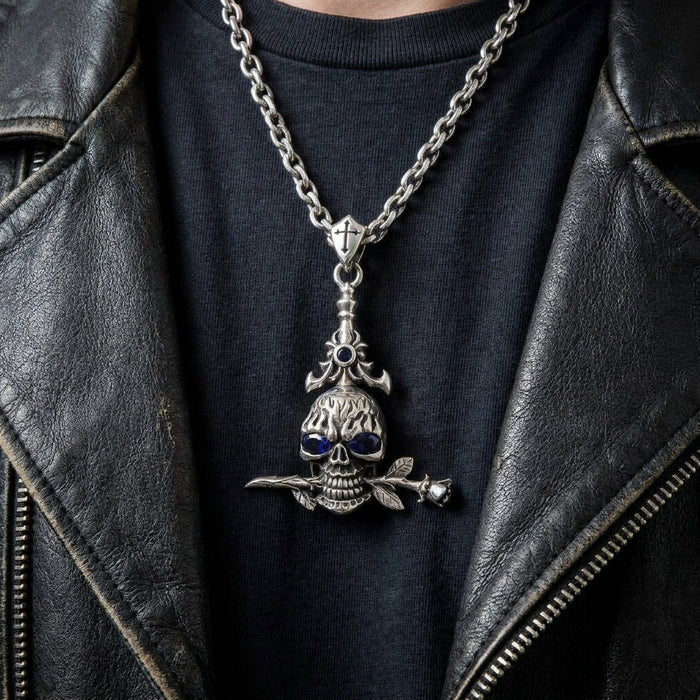 Lifestyle shot of the sterling silver skull pendant with blue cz eyes worn over a black t-shirt and leather jacket.