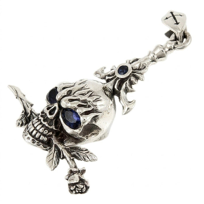 Diagonal view displaying the ornate bail, deep blue cubic zirconia eyes, and detailed rose stem in sterling silver.