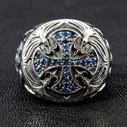 Top view of the Knights Templar cross ring showing pave-set blue sapphire CZ stones and floral silver carvings