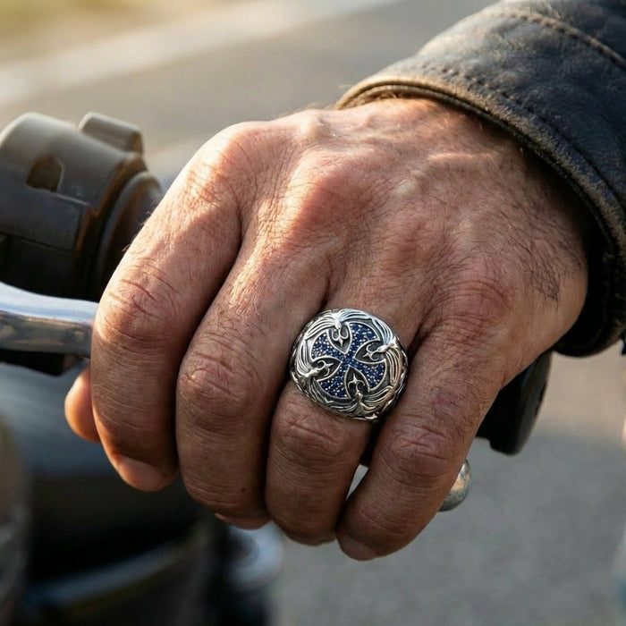 Man wearing the blue cross sterling silver ring while gripping a motorcycle handlebar