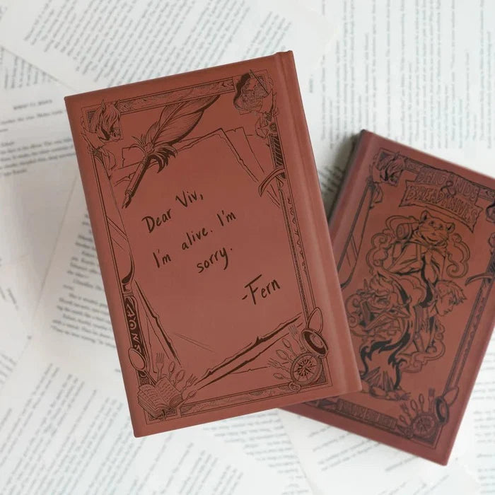 Brigands & Breadknives LitJoy Edition hardcover back cover with handwritten note from Fern, shown beside a second debossed hardcover book