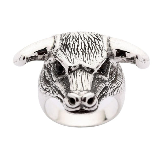 A solid sterling silver bull head ring with genuine black onyx eyes and detailed, ruggedly textured fur.