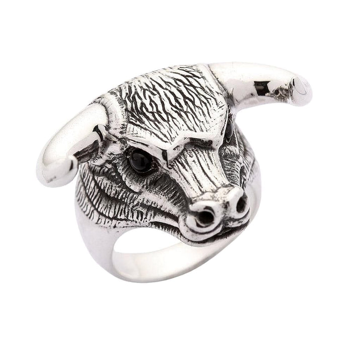 A handcrafted bull head ring with intricate details and a high-contrast oxidized finish on the fur.