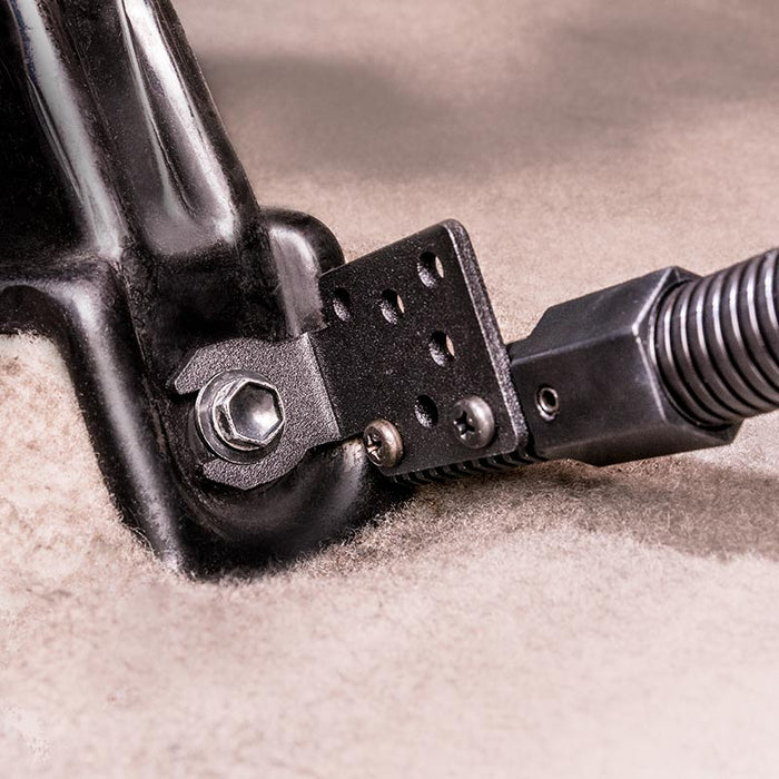 Close-up of the Car Seat Rail or Floor Mount with 22 Gooseneck and AMPS Head for Satellite Radios, a black metal bracket secured by bolt to carpet, featuring a coiled cable and using the 4-hole AMPS mounting pattern for secure attachment.