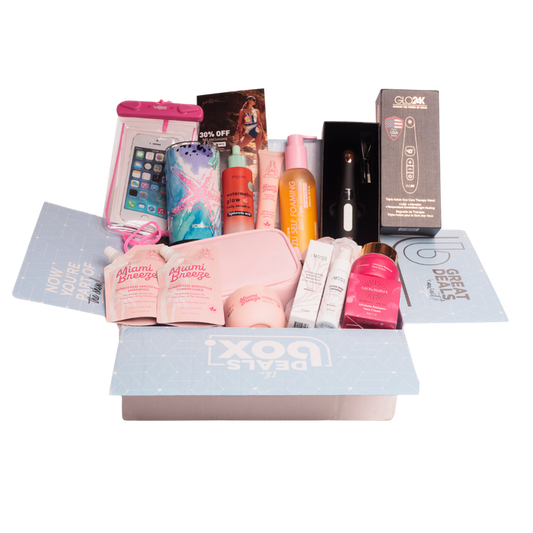 A beauty gift box set from Deals Box, featuring a light blue box with 'DEALS BOX' printed on the front, filled with various beauty products including a pink phone pouch, a blue patterned hair dryer cover, a pink and orange bottle, a black box of eyeliner, and several pink and white cosmetic tubes and packets.