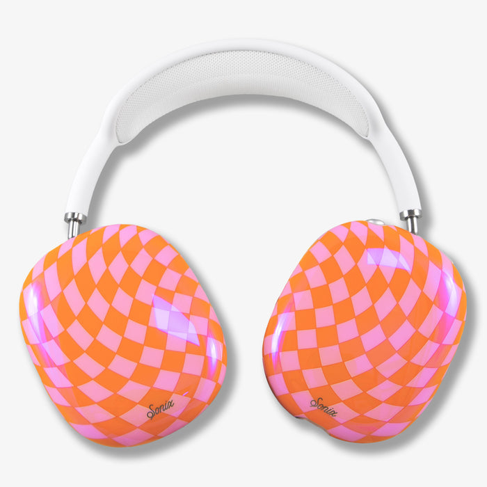 Close-up top view of AirPods Max cover showing Checkmate pink and orange checkered ear cups and white mesh headband on light gray background