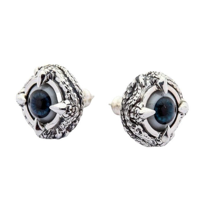 Sterling silver gothic eyeball earrings angled view displaying textured claw border and three-dimensional depth
