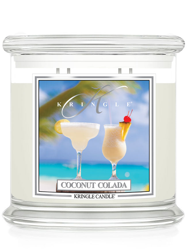 Kringle Candle Coconut Colada scented candle with a tropical design on the label.