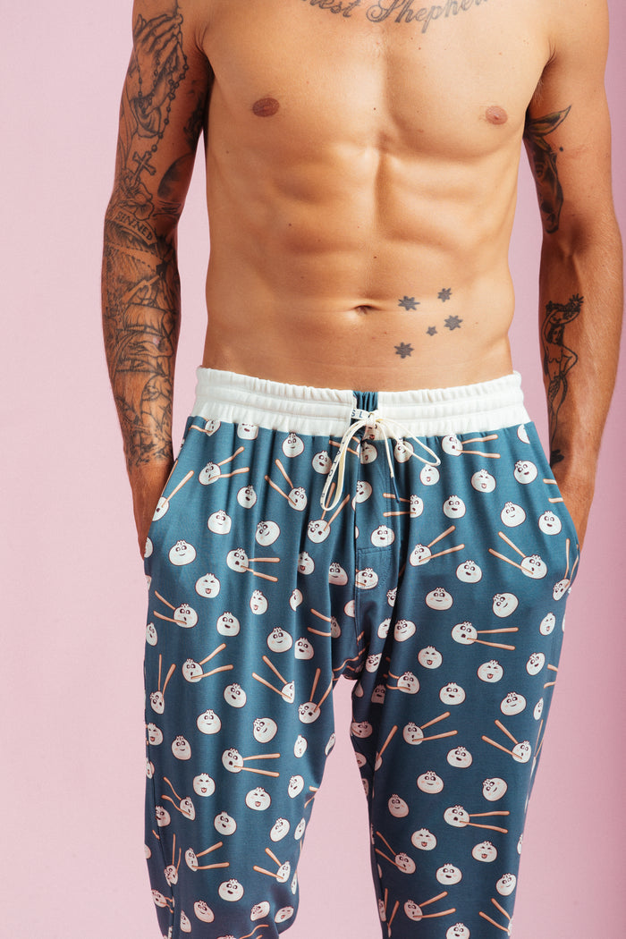 Dumpling Pants mens blue dumpling-print lounge pants on model - Slouch Potato Pizza & Dumplings