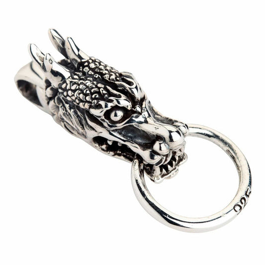 A front view of the heavy sterling silver Eastern dragon guardian pendant with detailed scales.