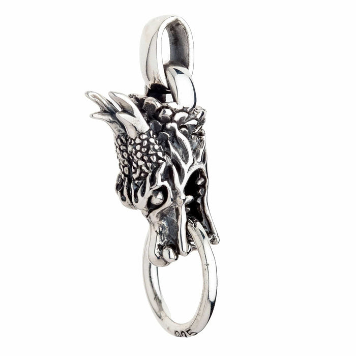 An angled view of the gothic Chinese dragon pendant, highlighting its three-dimensional craftsmanship.
