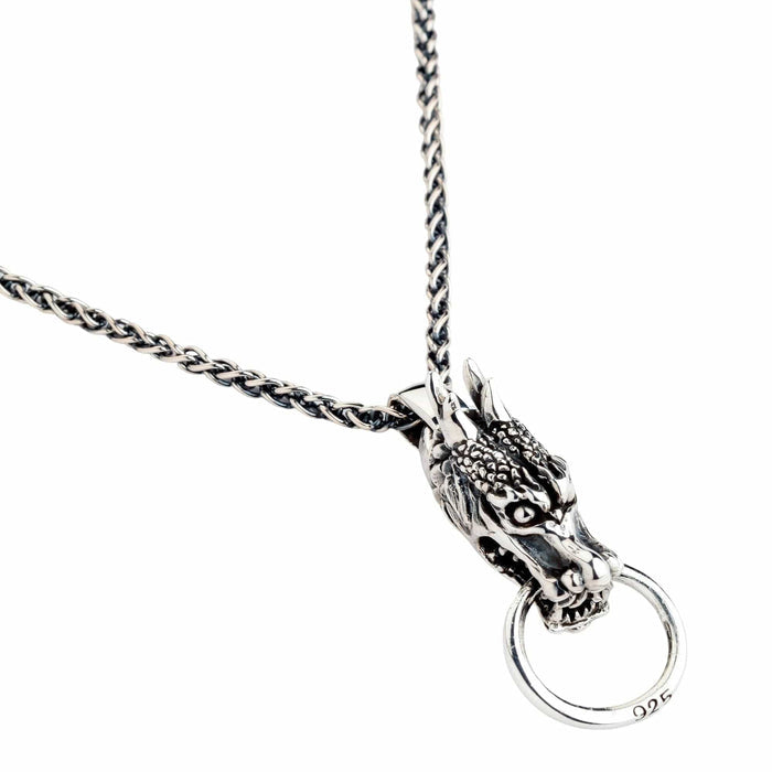 The heavy biker dragon pendant shown on a sterling silver chain to represent it as a complete necklace.