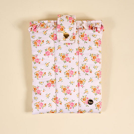 The Endless Daydream Cream Book Cover by the-darling-effect is a cute, puffy polyester cover with a pink and yellow floral print, ruffled top edge, and gold button flap closure, shown on a beige background.