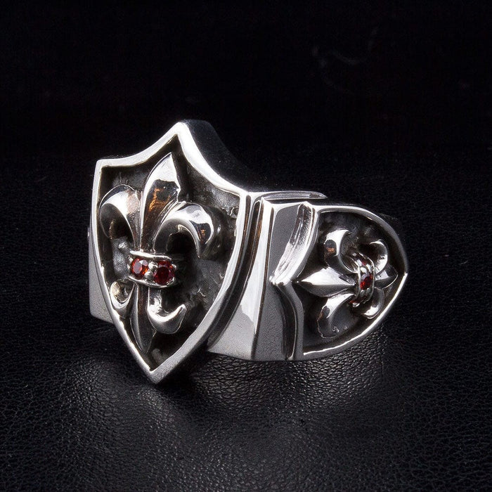 925 sterling silver Fleur De Lis ring showing triple shield design with garnet accents