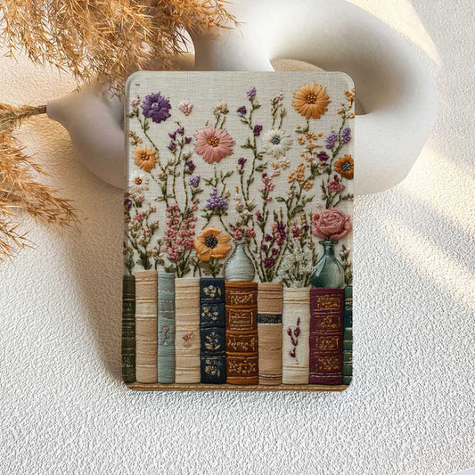 Decorative coaster with floral design and books on a textured surface
