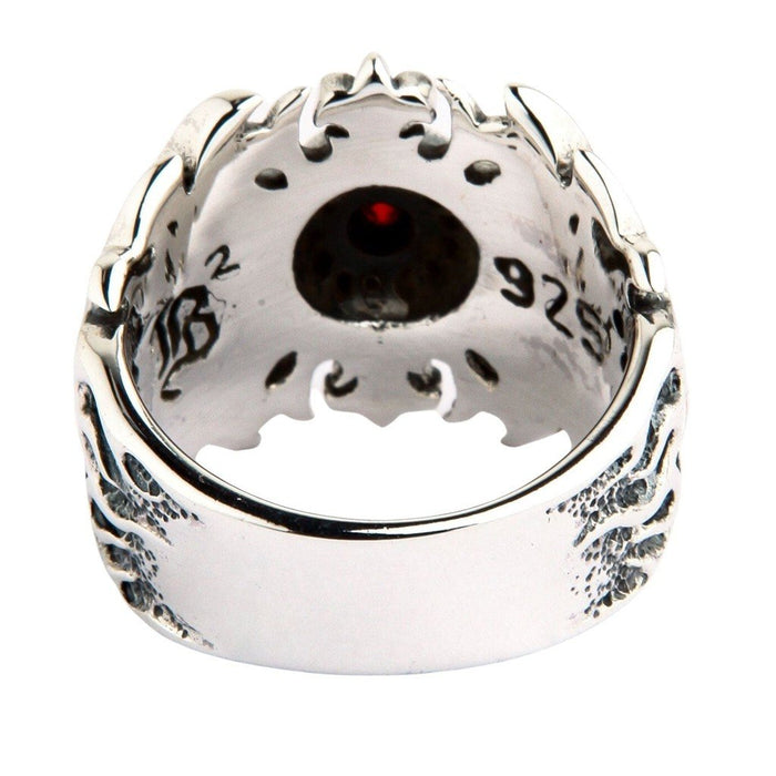 Back interior view of sterling silver tribal ring showing 925 hallmark stamp and red garnet visible through setting