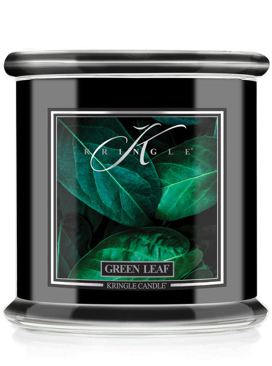 Kringle Candle with green leaf design on a white background