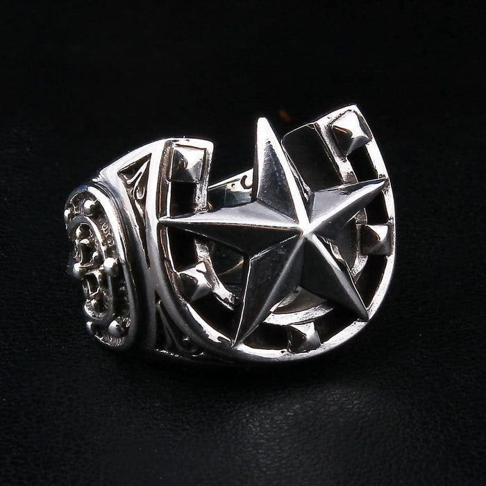 Three-quarter left angle view of men's good luck horseshoe signet ring showing star and helm shank detail
