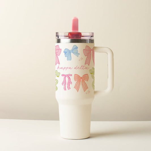 The Darling Effect’s Kappa Delta 40 oz Lifestyle Flip Straw Tumbler Bow Affair features colorful bows, “kappa delta” in pink script, a clear leak-resistant lid, and a pink straw, shown against a plain light background.