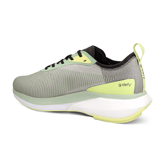 gdefy running shoe with light green mesh upper, neon yellow accents, and a thick white and light green sole, back angle.