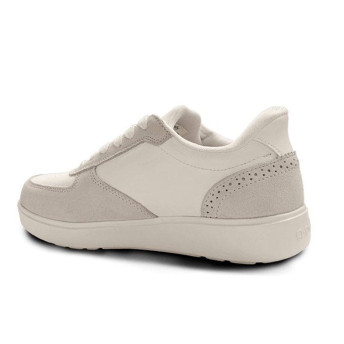 Cream-colored leather and suede sneaker, back-angle view, featuring perforated details on the side panel and a subtle heel lo