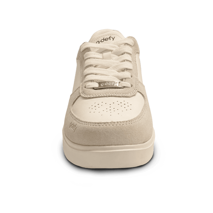 Cream and beige low-top sneaker featuring leather and suede panels, a perforated toe box, and a 'g-defy' logo on the laces, f