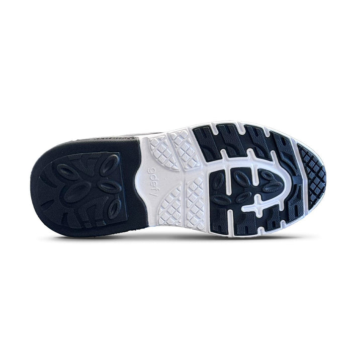 Sneaker sole with black and white patterned tread, featuring the gdefy logo on the white arch.