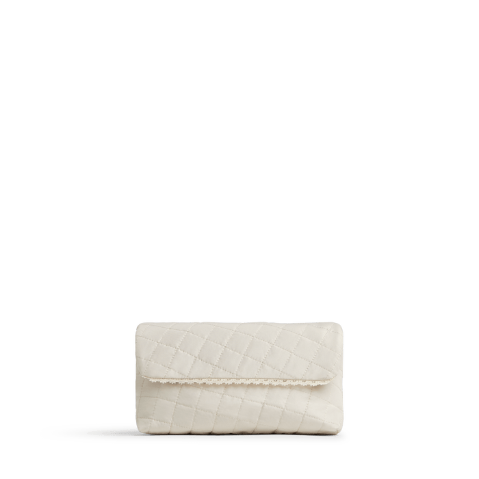 Cream Scaled | Front view of Monos x Reformation cosmetic pouch in cream