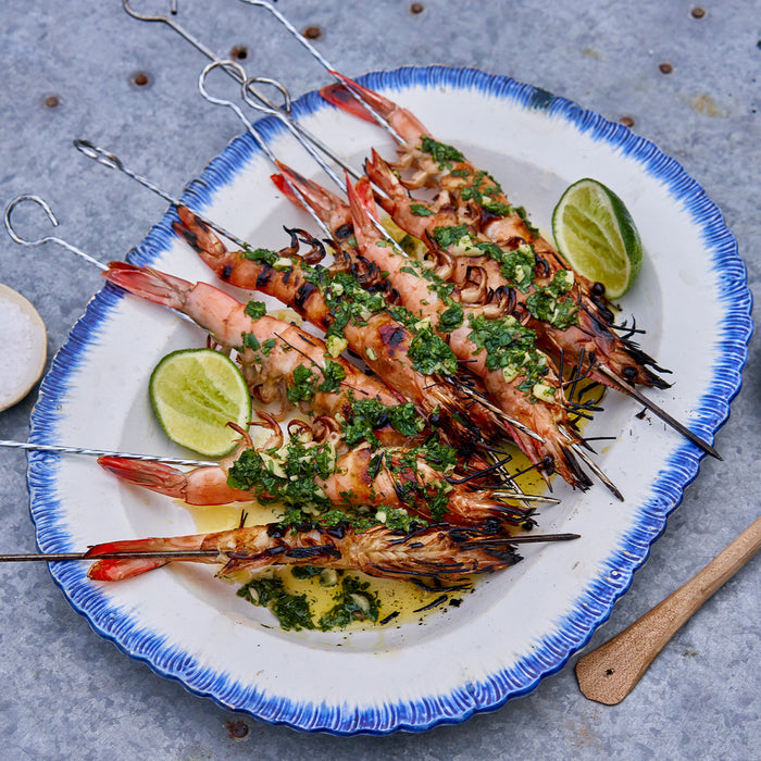 cooked Caledonia blue prawns seasoned and skewered