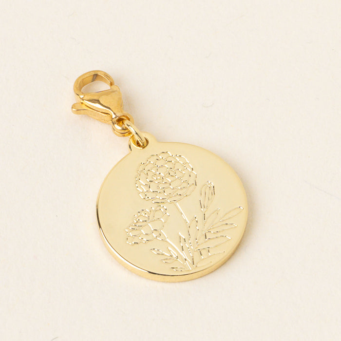 The October Jewelry Birth Flower Charm Gold by the-darling-effect is a round gold charm engraved with two flowers and leaves, attached to a lobster clasp—an ideal gift for birth flower charm lovers.