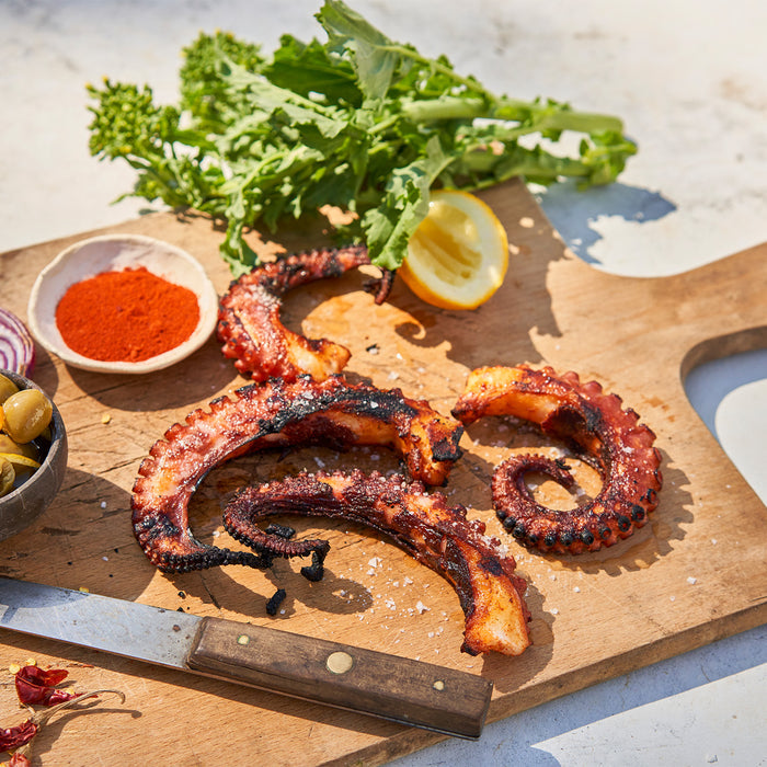 Cooked octopus on a chopping block