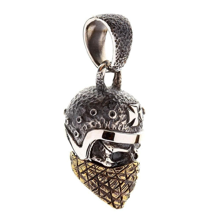 An angled view of the heavy two-tone skull pendant, highlighting the textured helmet.