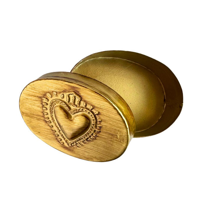 Oval brass heart-shaped trinket box with decorative details, ideal for jewelry or small keepsakes, by Saint Austin Company.