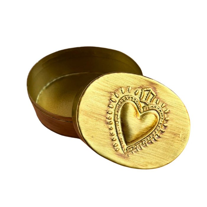 Oval brass heart trinket tray by Saint Austin Company, featuring a decorative heart-shaped design for jewelry storage.
