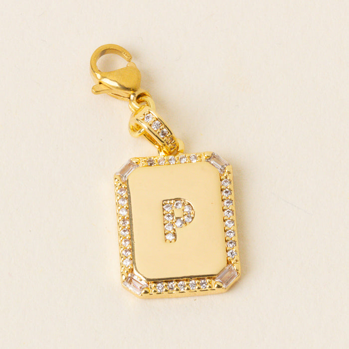 The P Jewelry Charm Initial Letter Gold by the-darling-effect is a personalized gold pendant with a diamond-encrusted border and a diamond-studded letter P on a white background—perfect for initial jewelry lovers.